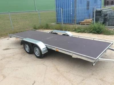 Platforminės priekabos sunkiajai technikai