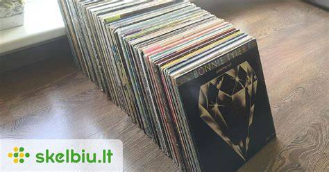 Vinilo plokštelės lentelė su skaičiais ir grafika about “Muzikos salė” mugėje